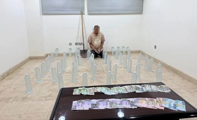 Asian Expat Caught Burying 48 Liquor Bottles in Kuwait Desert